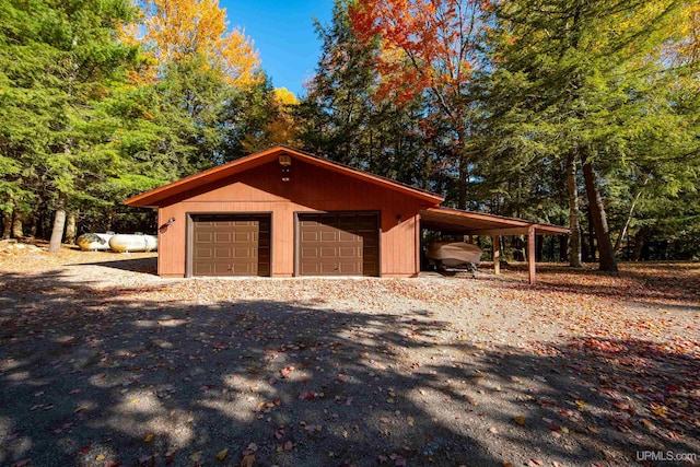 garage featuring a carport