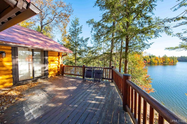 wooden deck featuring a water view