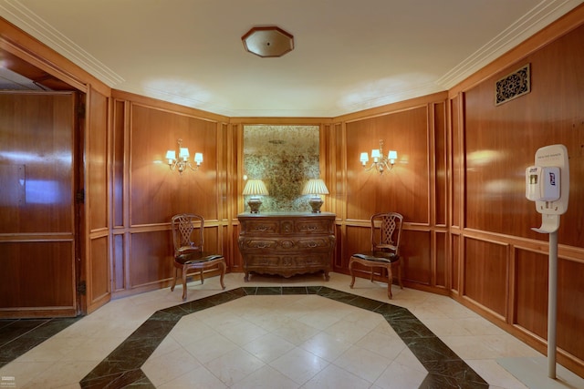 corridor with crown molding, wood walls, an inviting chandelier, and light tile patterned floors