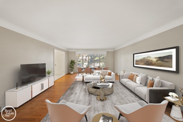 living area with baseboards and wood finished floors