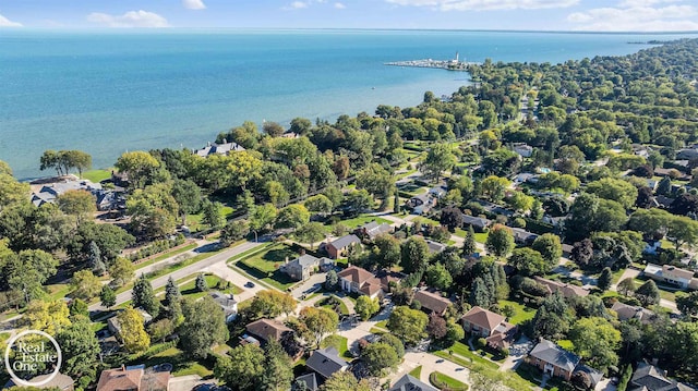 drone / aerial view featuring a water view and a residential view