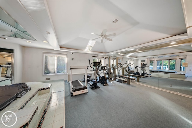 gym featuring a tray ceiling, visible vents, a ceiling fan, and recessed lighting