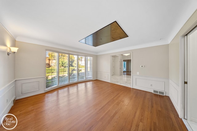 unfurnished room featuring hardwood / wood-style floors