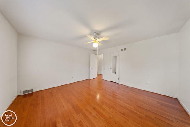 unfurnished bedroom with ceiling fan, baseboards, visible vents, and light wood-style flooring