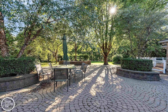 view of patio featuring outdoor dining area