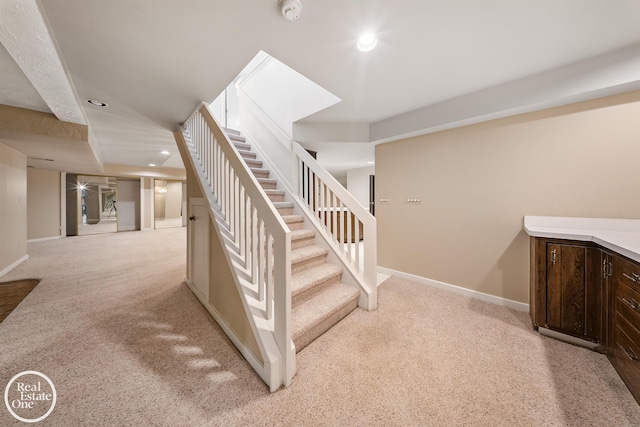 stairs featuring recessed lighting, carpet, and baseboards