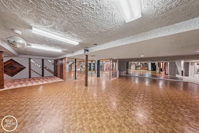 interior space with stairway and a textured ceiling