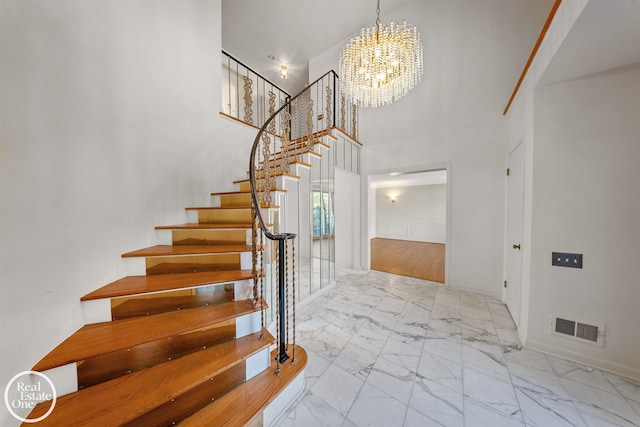 entrance foyer with a chandelier