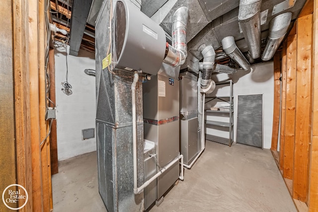 utility room featuring heating unit