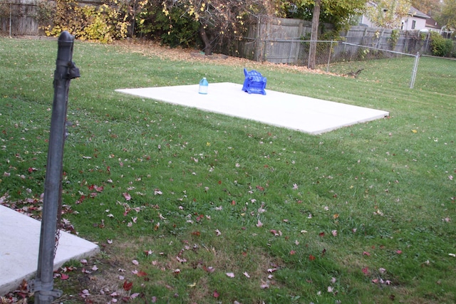 entry to storm shelter with a yard and a patio area