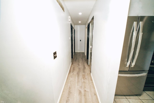 hallway with light wood-type flooring