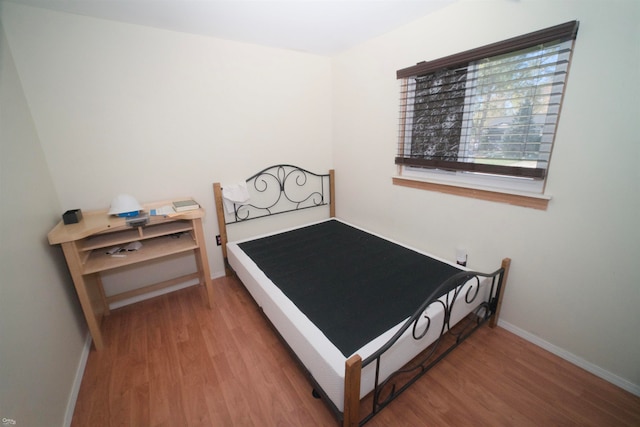 bedroom featuring wood-type flooring