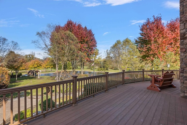 deck featuring a water view