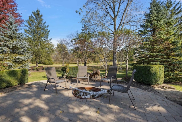 view of patio / terrace featuring an outdoor fire pit