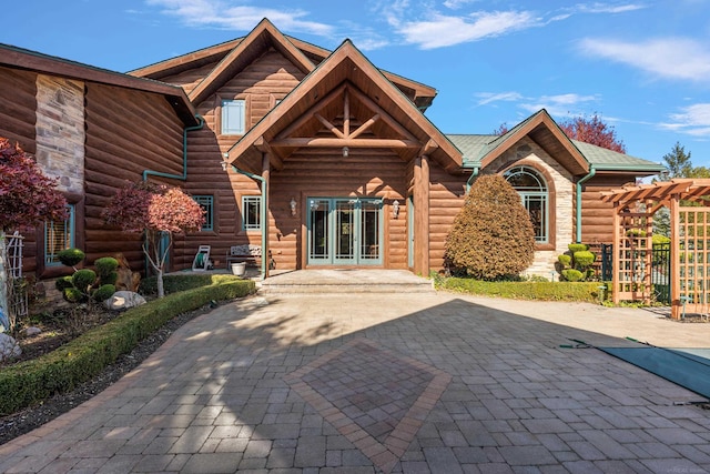 rear view of property featuring french doors