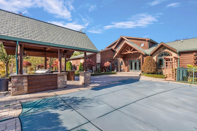 view of pool with a patio area and central AC