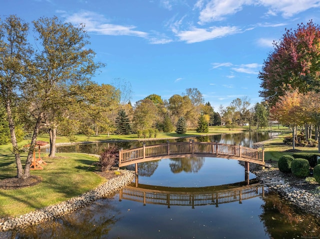 surrounding community featuring a water view