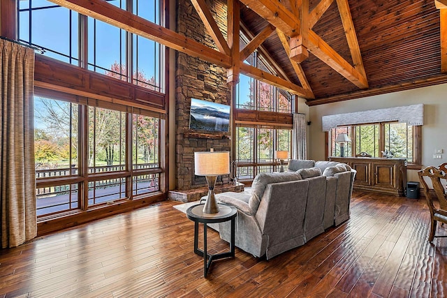 living room with wood ceiling, high vaulted ceiling, beamed ceiling, and wood-type flooring