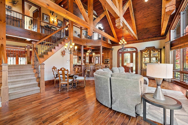 living room with wood ceiling, hardwood / wood-style floors, and high vaulted ceiling