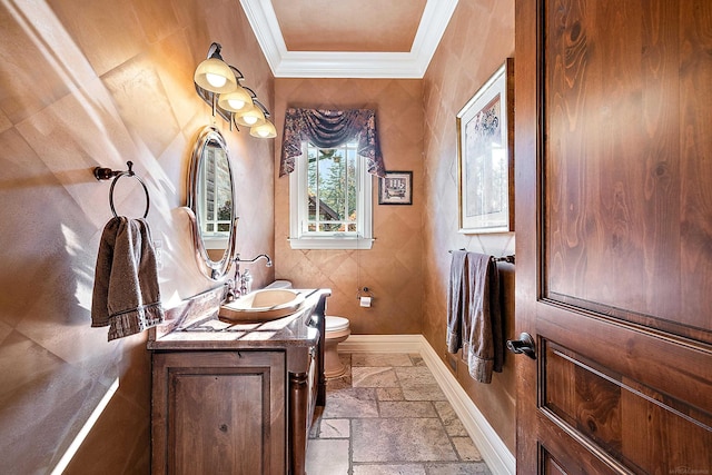 bathroom with vanity, ornamental molding, and toilet