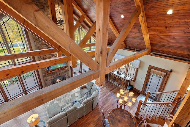 living room featuring wood ceiling, high vaulted ceiling, wood-type flooring, and plenty of natural light