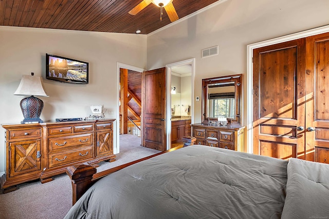 carpeted bedroom featuring ensuite bathroom, wood ceiling, ceiling fan, lofted ceiling, and crown molding