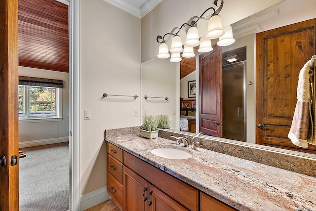 bathroom featuring vanity, crown molding, and a shower with shower door