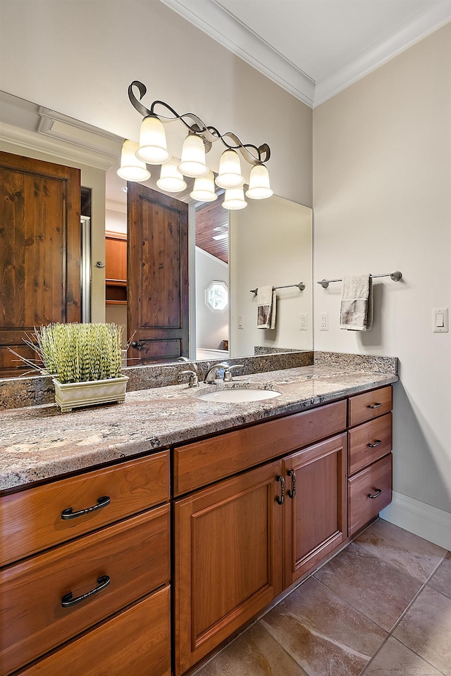 bathroom with vanity, crown molding, and tile patterned flooring