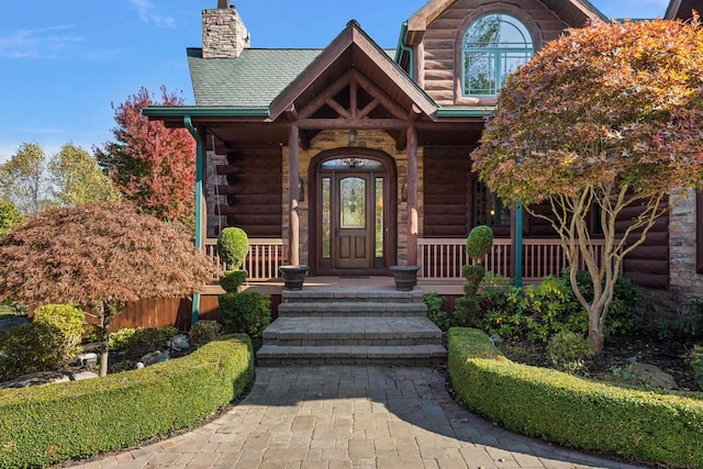 property entrance featuring covered porch