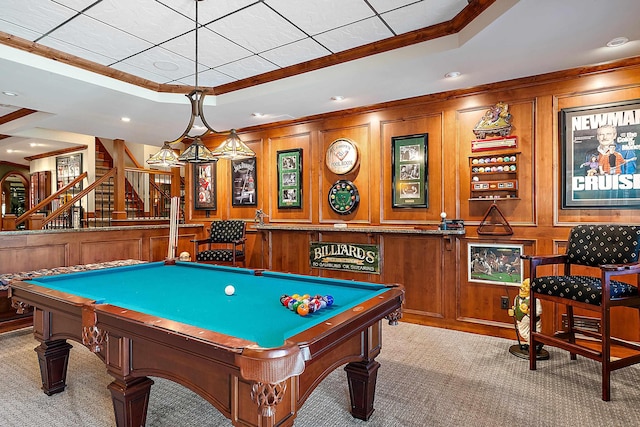 rec room featuring light carpet, wood walls, pool table, and ornamental molding