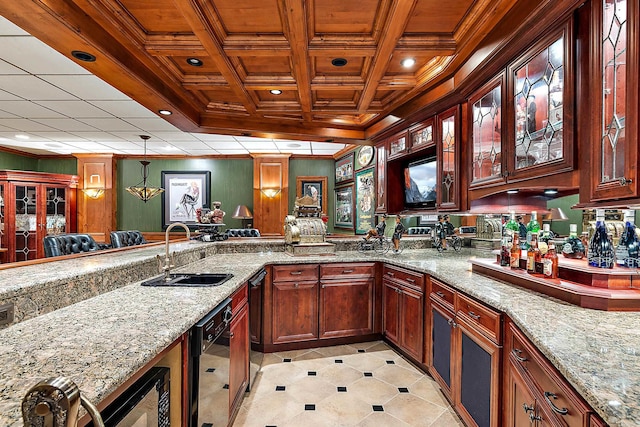 kitchen with sink, light stone countertops, hanging light fixtures, and coffered ceiling