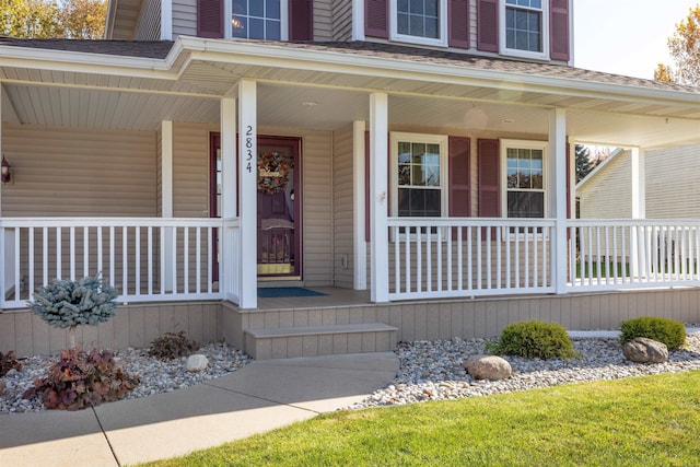 property entrance featuring a porch