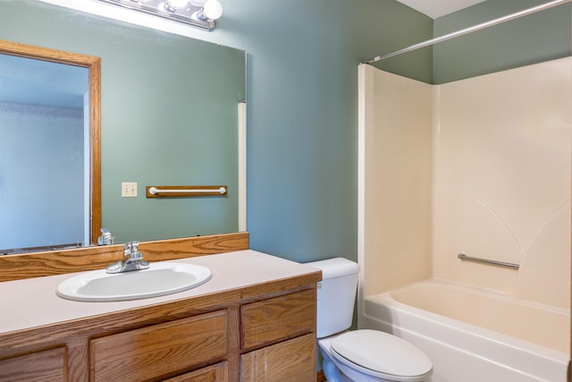 full bathroom featuring toilet, bathtub / shower combination, and vanity