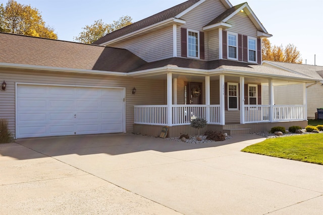 view of front of house featuring covered porch and a garage