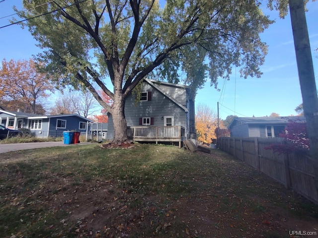 exterior space with a wooden deck and a yard