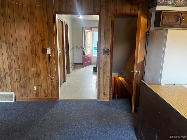 hallway with wooden walls