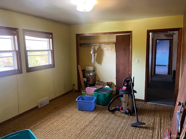 carpeted bedroom featuring a closet