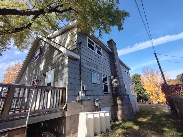 view of property exterior featuring a deck