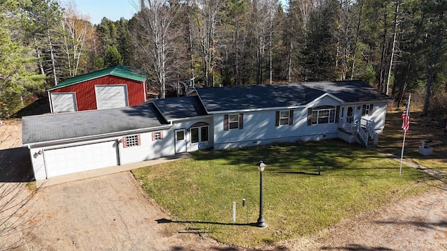 view of front facade featuring a front lawn and a garage