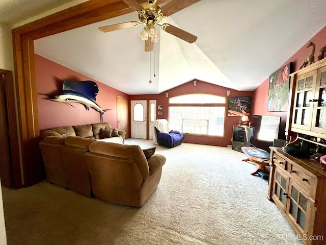 carpeted living room with lofted ceiling and ceiling fan