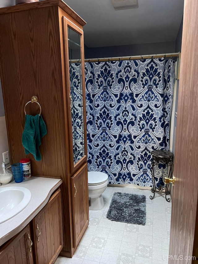 bathroom with vanity and toilet