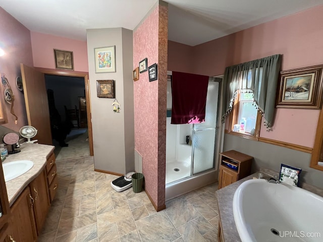 bathroom featuring vanity and shower with separate bathtub