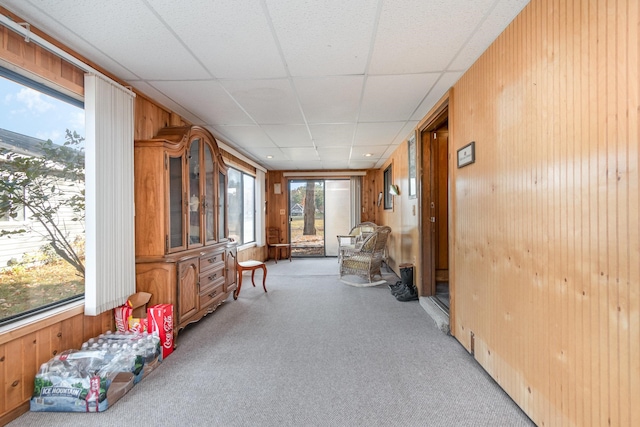 sunroom / solarium featuring a drop ceiling and plenty of natural light