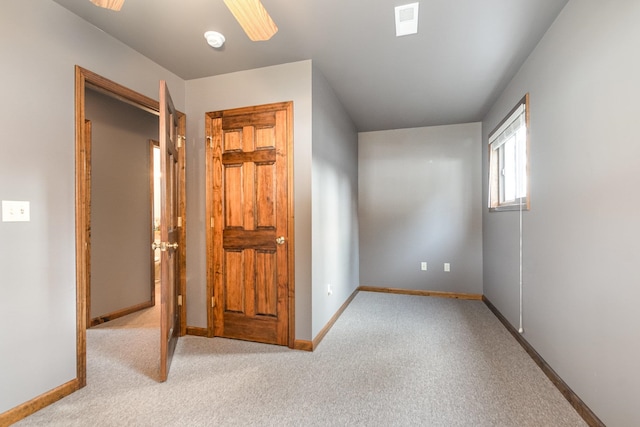 unfurnished bedroom featuring light colored carpet