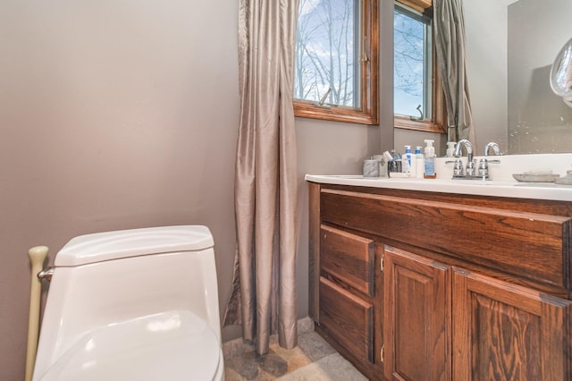 bathroom with vanity and toilet