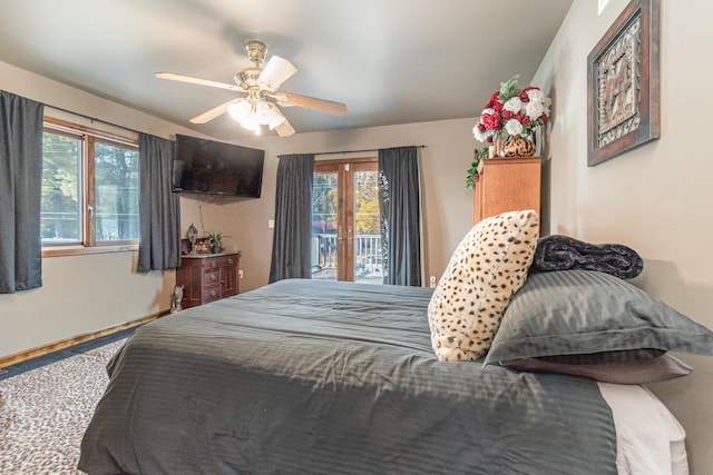 bedroom featuring ceiling fan, multiple windows, carpet floors, and access to exterior