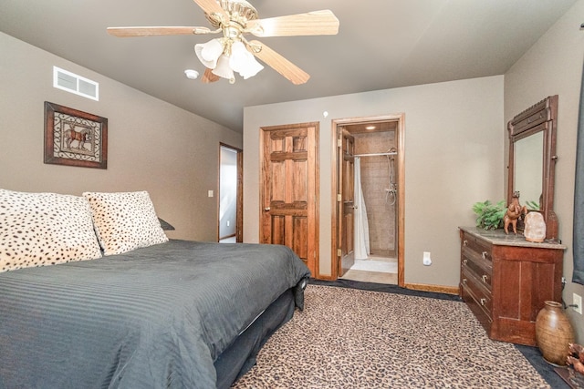 bedroom featuring ensuite bathroom, carpet, and ceiling fan