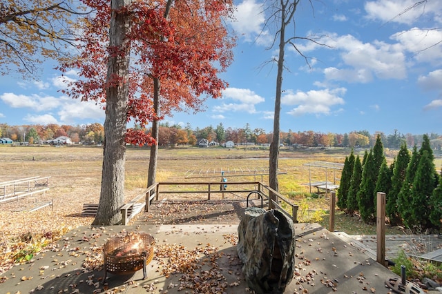 view of yard with a rural view