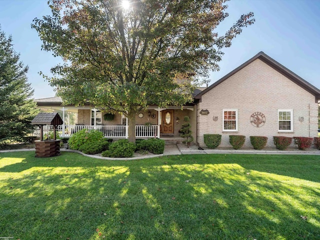 view of front of home with a front yard and a porch