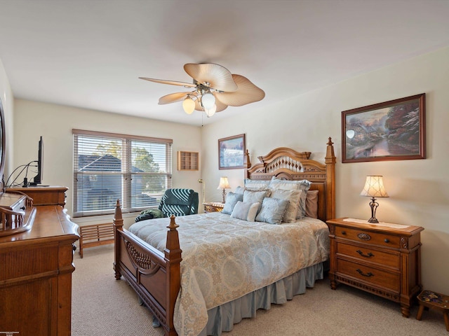 bedroom with light colored carpet and ceiling fan